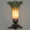 Decorative lamp with a butterfly resting on the base green and a green and white satin lily glass shade.