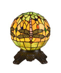 Dragonfly globe green orange memory lamp illuminated.