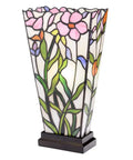 Decorative vase-shaped lamp with floral stained glass design on a white background.