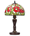 Tiffany-style Genevieve Table Lamp with floral stained glass shade on a white background.